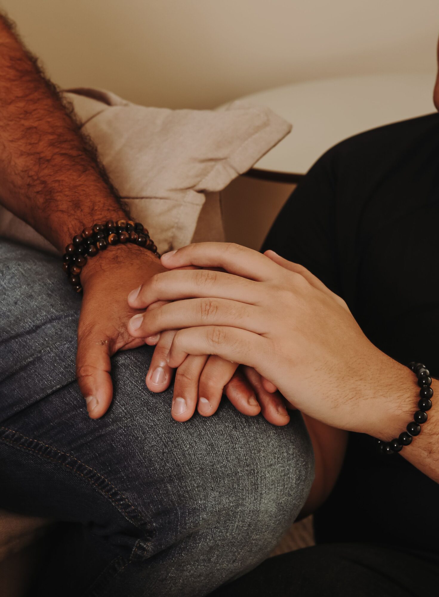 Two hands held together in comfort and support