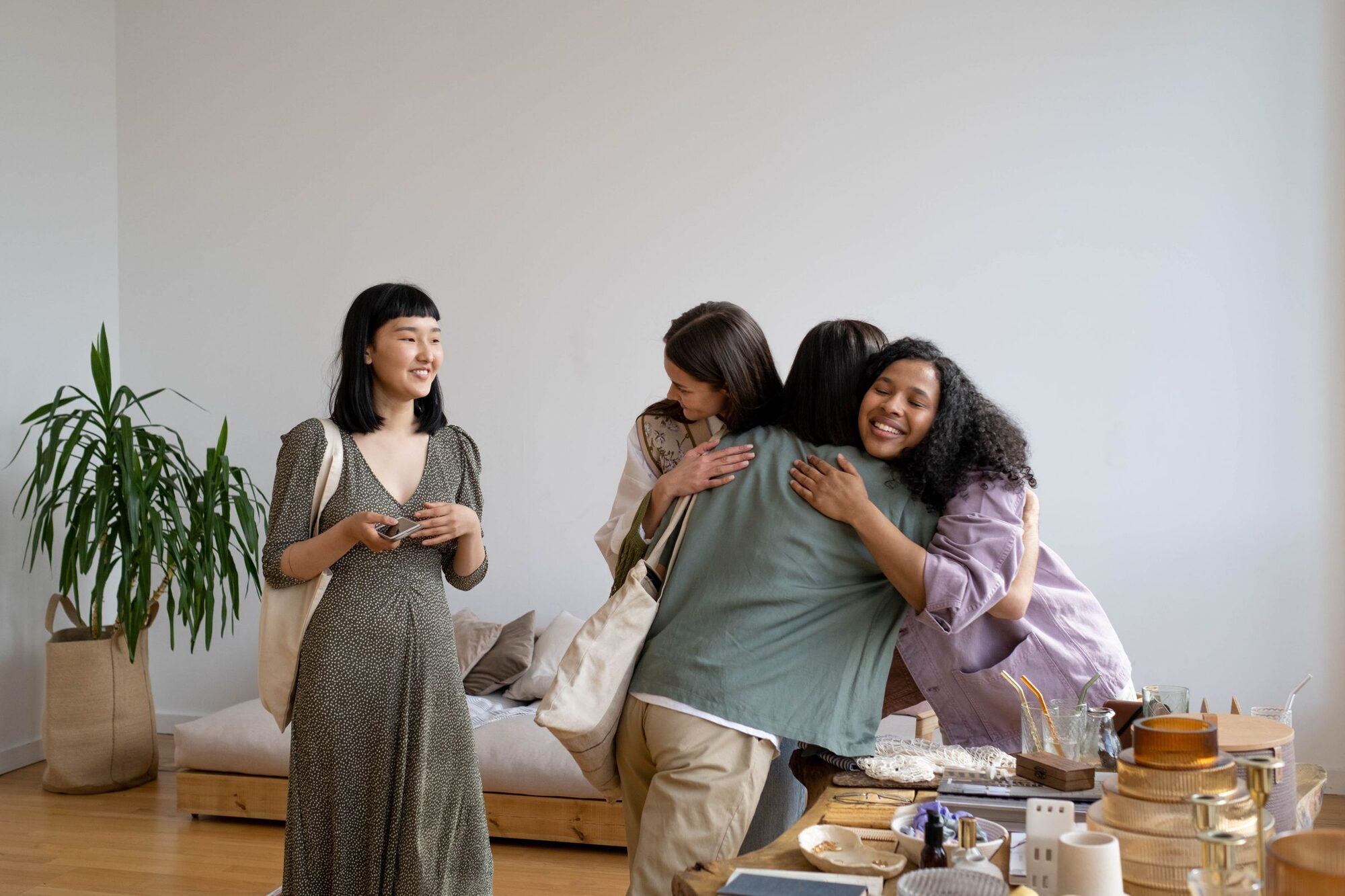 Women sharing a warm, welcoming embrace in the home
